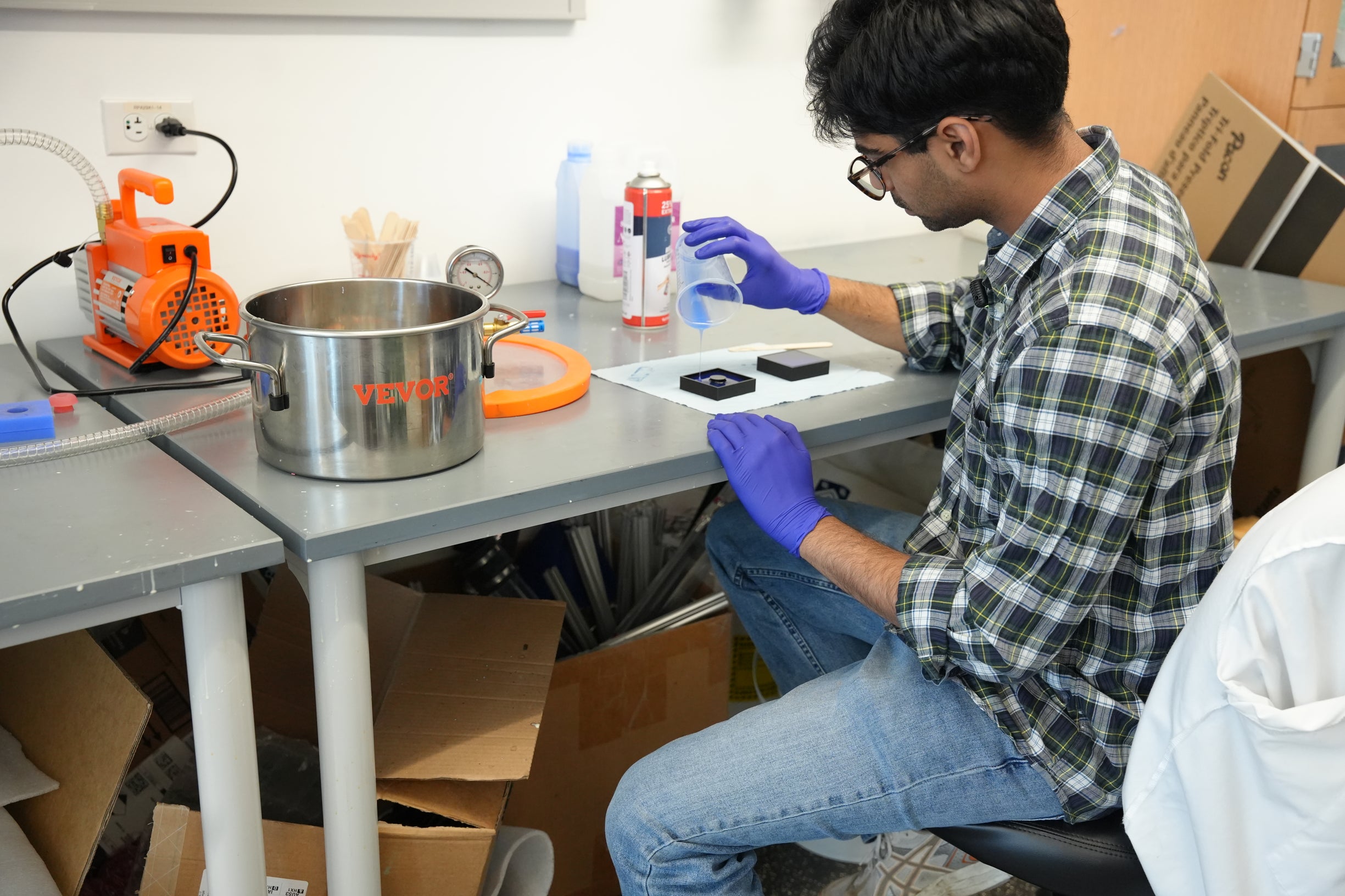 Photo:Alek working to iterate on the LUCIA device
