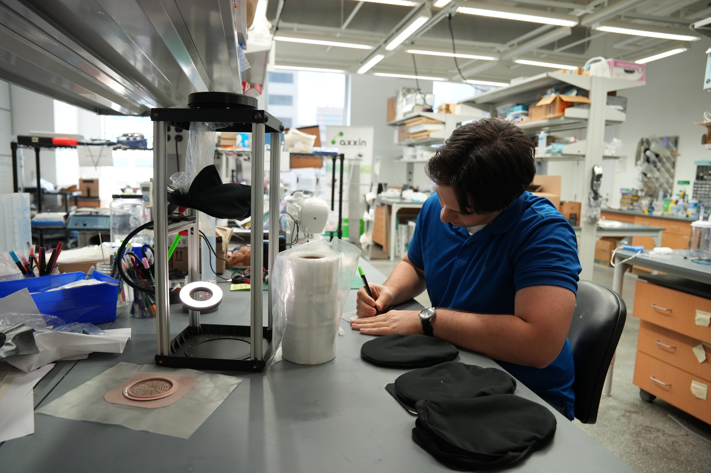 Photo: Ben working on the device adhesive system