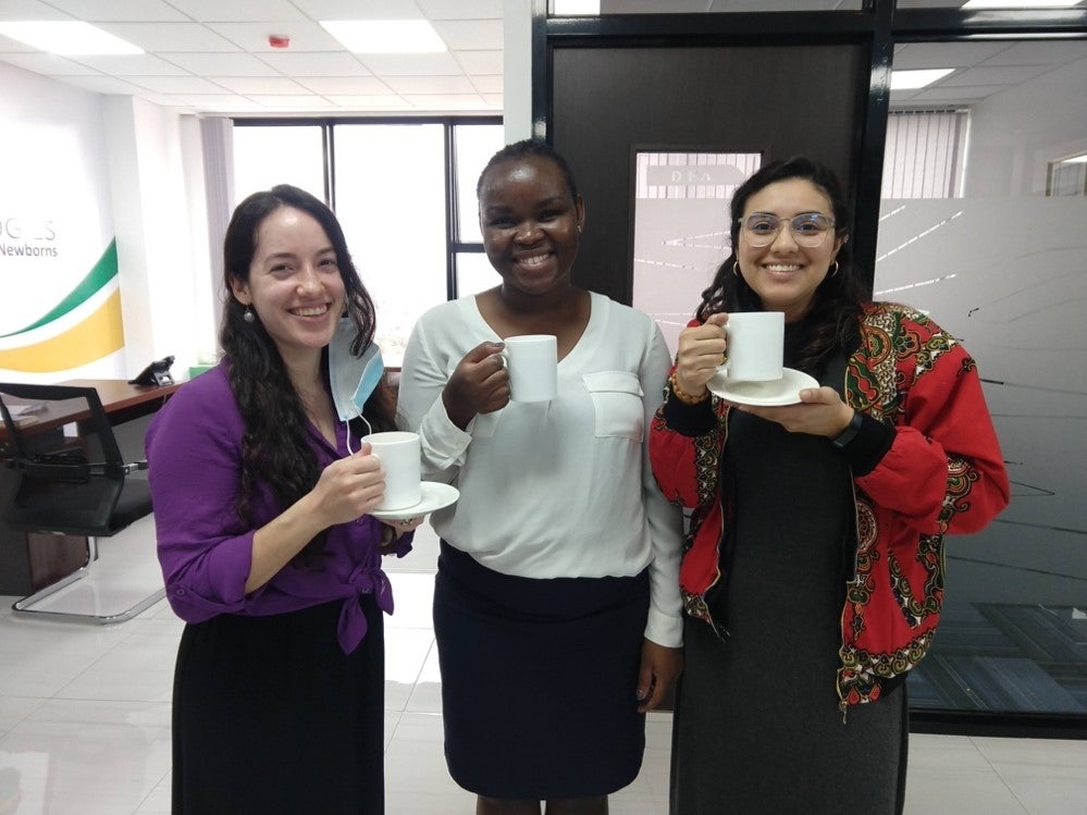 Natalie pictured with other fellows drinking tea